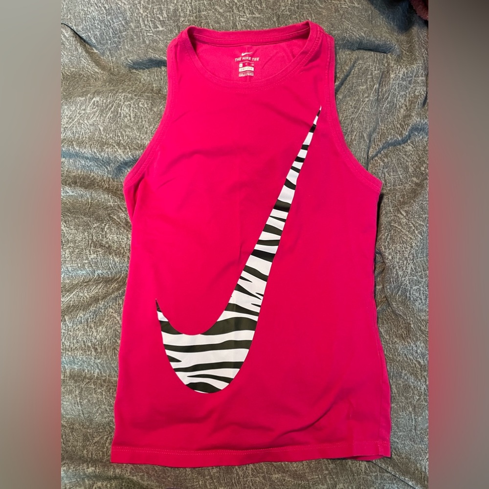 The Nike Tee size small dri fit hot pink with zebra check.